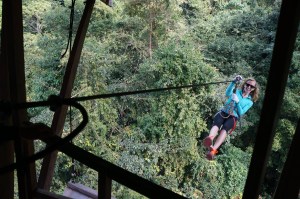 Alison ziplining into our treehouse, which is the only way to access it.