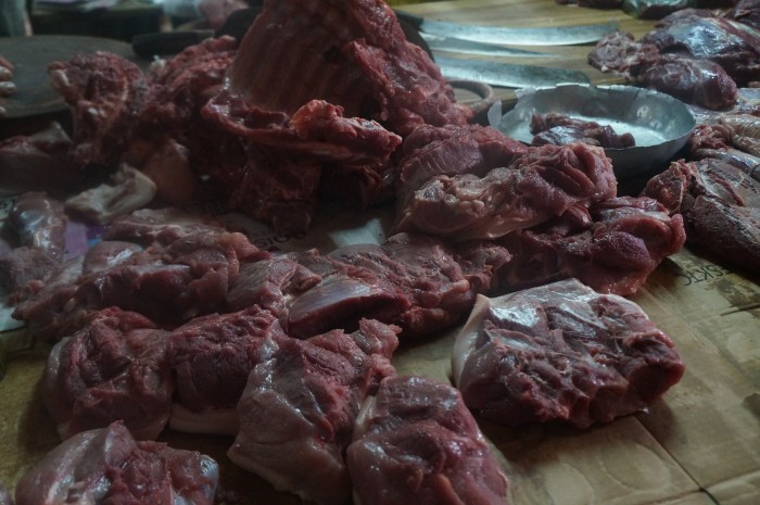 Shopping for ingredients in the meat market (this cow had been slaughtered that morning)