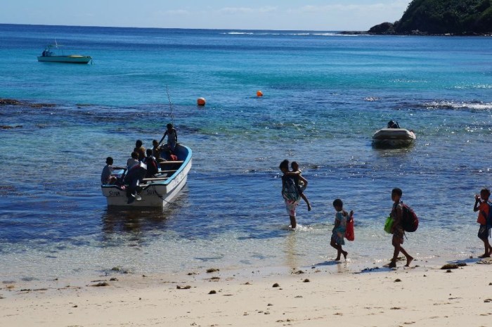 The local children getting on their "bus" to head to another island for school.