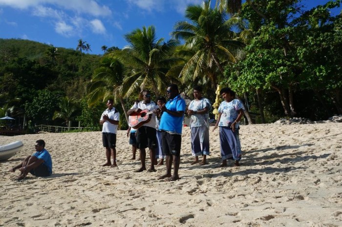 Here is the wonderful welcoming crew singing and greeting everyone upon their arrival to the island.