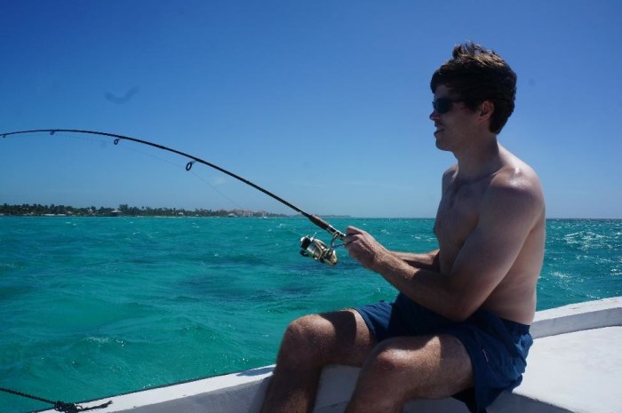 Walker reeling in a snapper