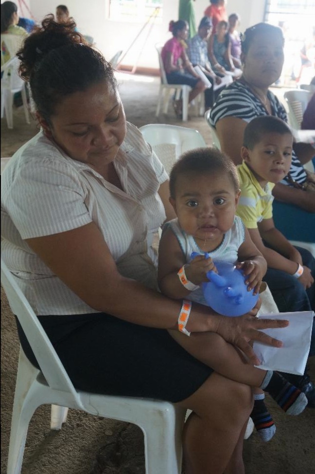 While waiting to be seen by a provider, we gave this sweet little boy a makeshift toy to keep him busy.