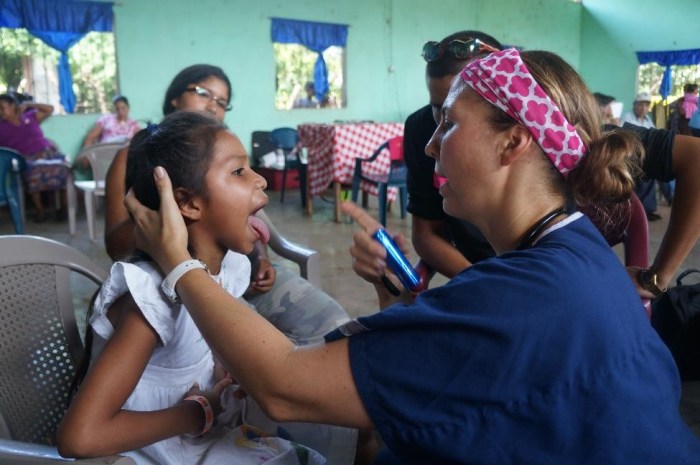 Dr. Evans, our pediatrician, examining a patient.